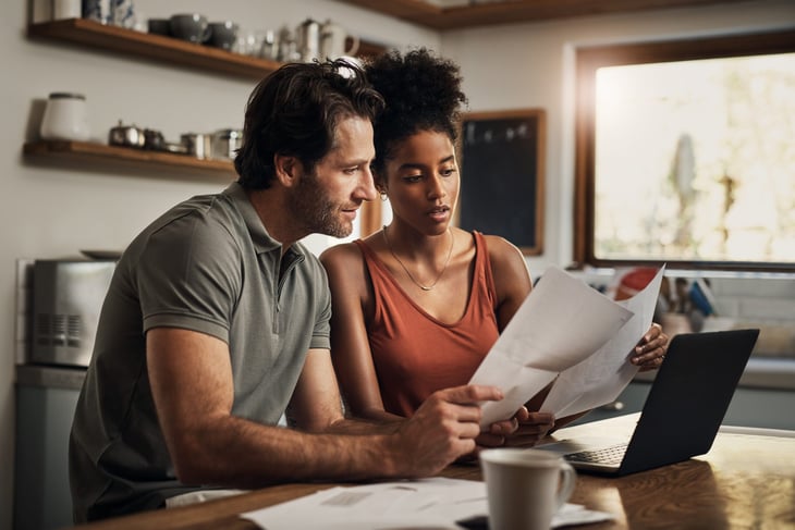 Couple reviewing financial documents