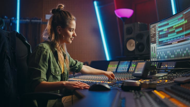 Audio Engineer and Producer Working in Music Recording Studio