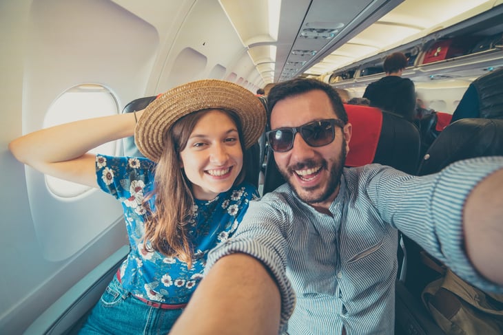 Happy couple on an airplane