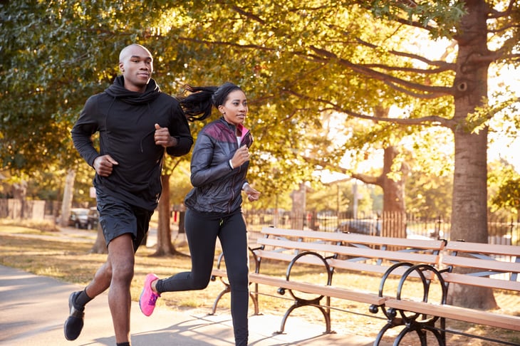 Young couple running in the park