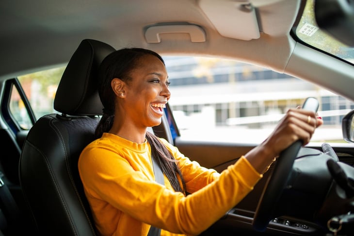 Happy woman car driver