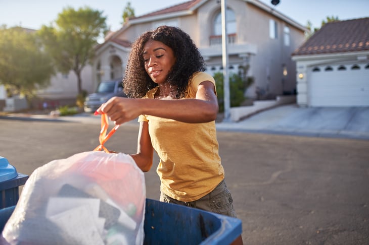 Woman taking out the trash in a Las Vegas neighborhood.