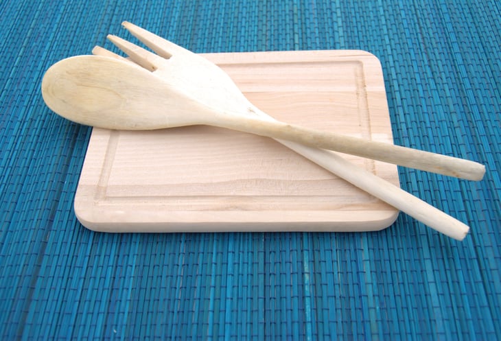 Wooden spoon, fork and cutting board or trivet