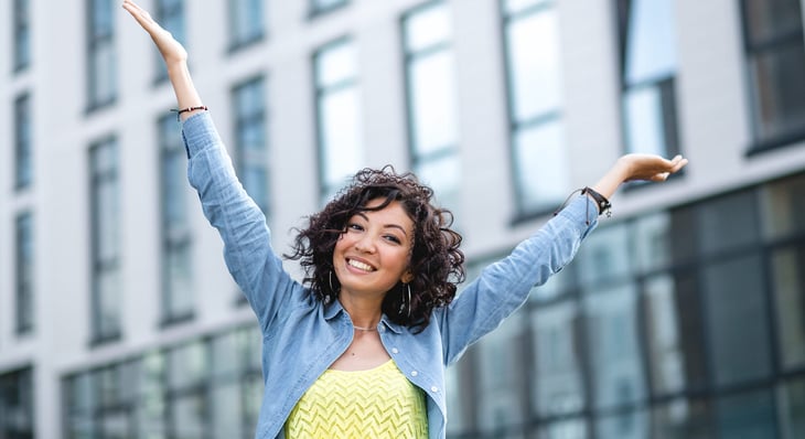 Young happy woman living in city
