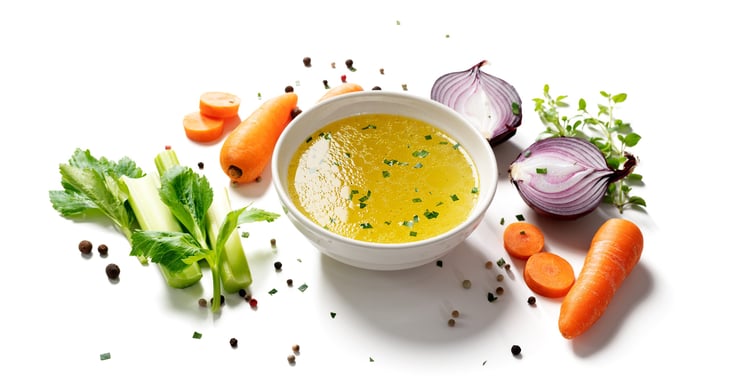 Chicken broth or stock with vegetables