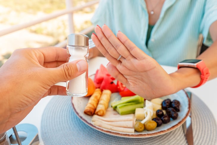 Woman refuses salt shaker at a restaurant because she doesn't want more sodium