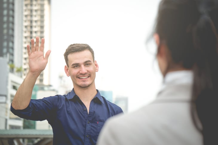 Man waving hello