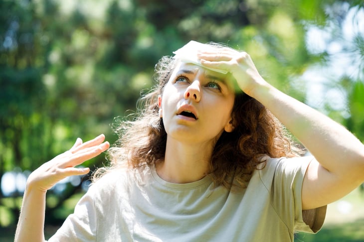 Woman sweltering in the heat