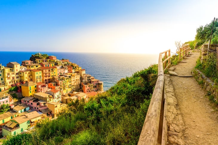 Manarola village in beautiful scenery of mountains and sea - Spectacular hiking trails in vineyard with flowers in Cinque Terre National Park, Liguria, Italy