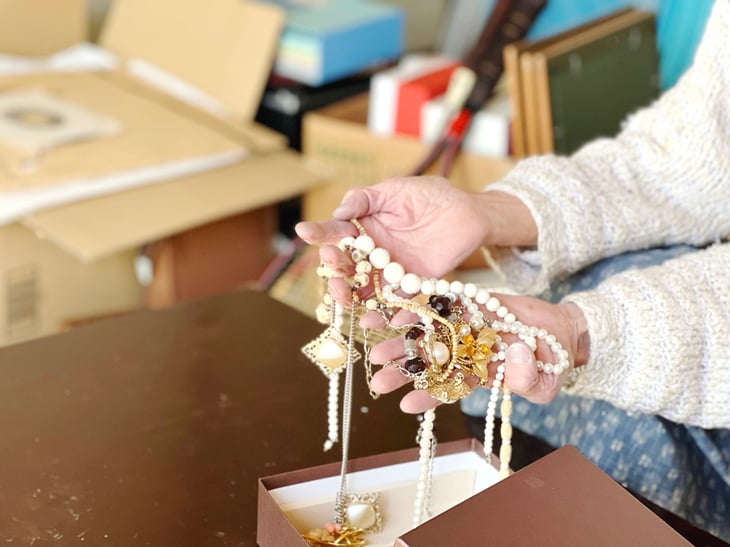 Woman holding jewelry