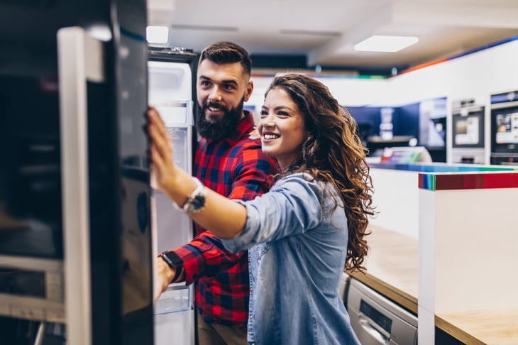 Couple shopping for a refrigerator