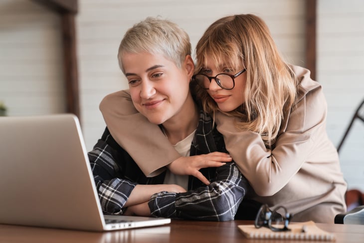 Couple looking at a laptop