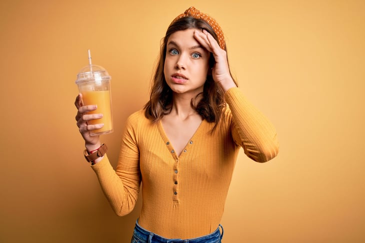 young woman girl with orange juice