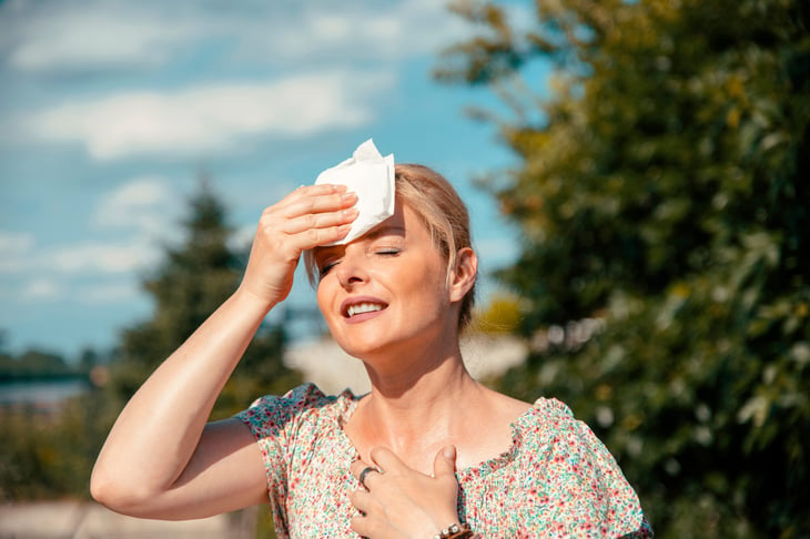 Woman feeling the heat outside during summer