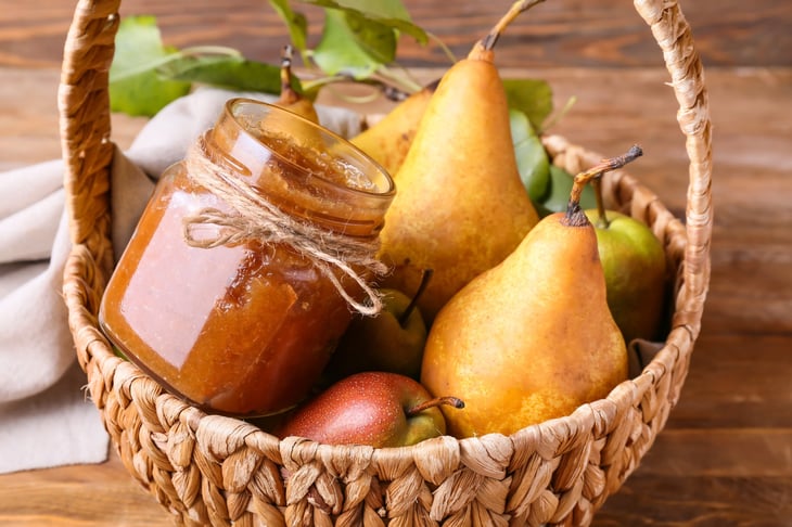 Basket with glass jar of pear butter
