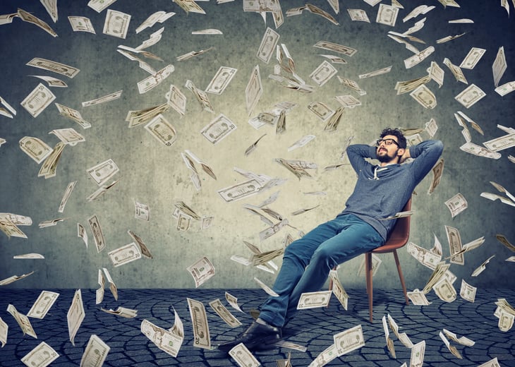 Man being showered with money