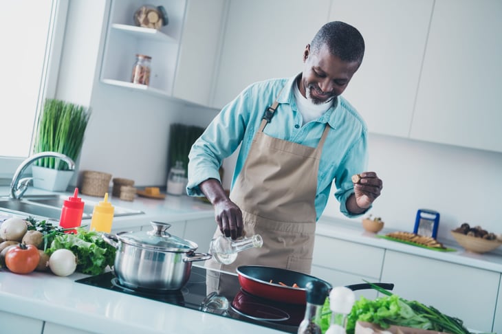 Man cooking on a stovetop