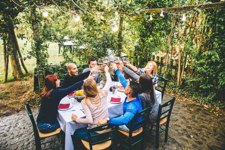Friends eating together outdoors