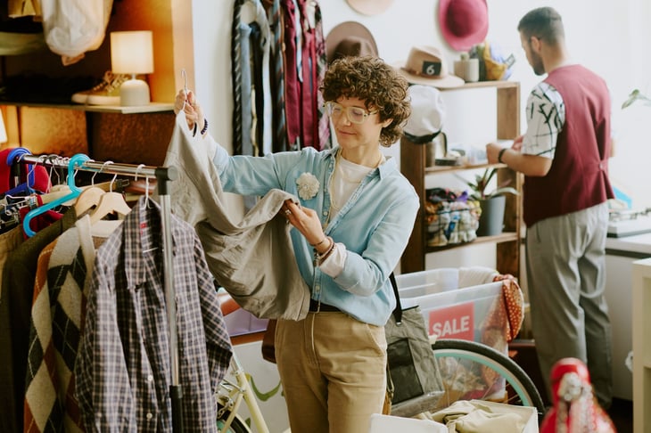 Person shopping for clothes in secondhand store