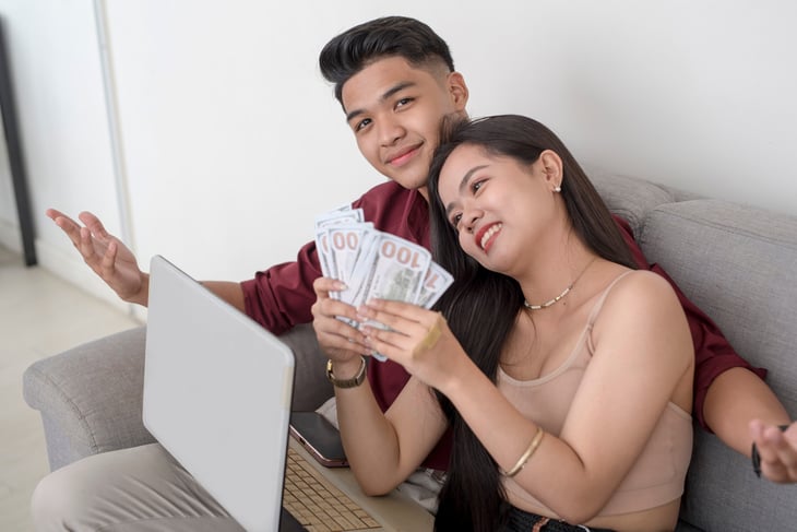 Young couple foolishly spending money