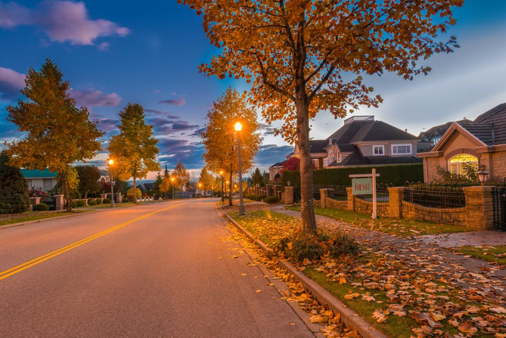 Empty street at at night in a neighborhood
