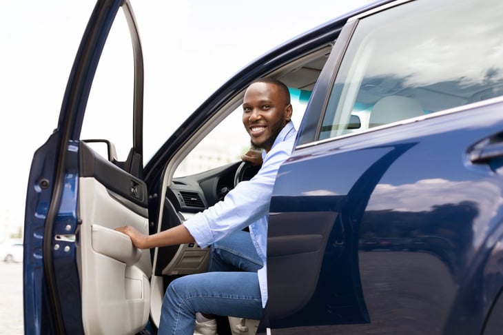 Man in a black car