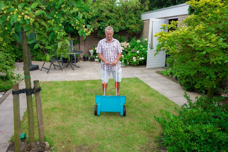Man fertilizing his lawn