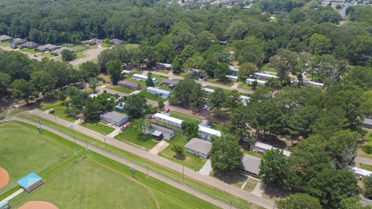 Large baseball fields near row of manufactured, modular, and mobile homes in Richland, Rankin County, Mississippi suburb of Jackson
