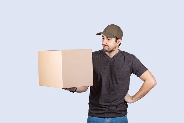 Man looking at box