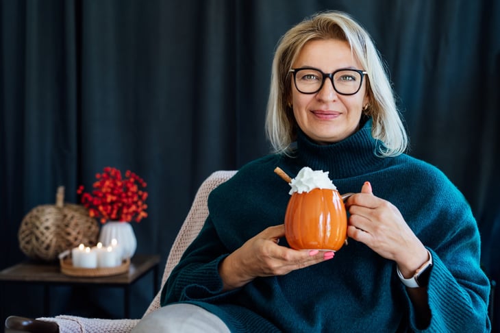 Woman with a pumpkin mug