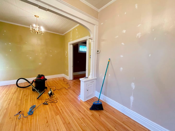 A home remodeling project with fresh paint and open space for touching up walls 