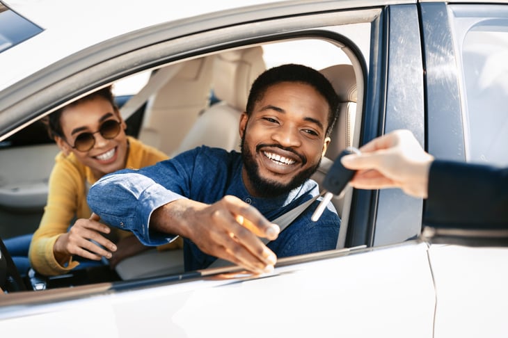 Happy owner of a new car gets the keys