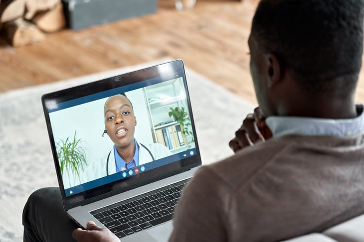 Patient talking to doctor in virtual visit