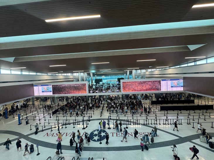 Crowds gather in Nashville International Airport during a busy travel season