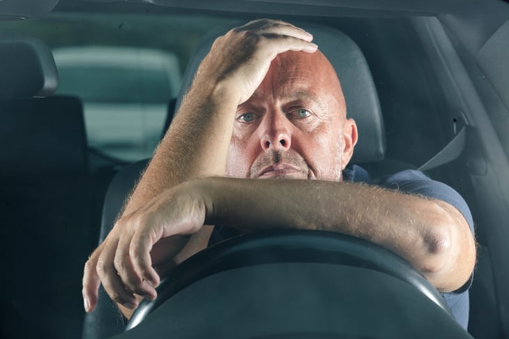 Bored male driver who hates his car