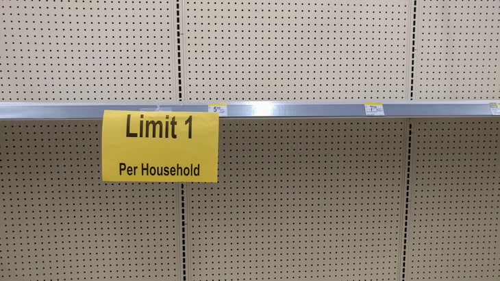 Store sign on empty shelf for per customer limit on purchases