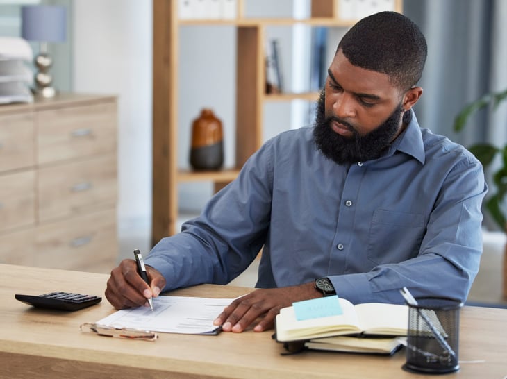 Determined man planning budget and finances