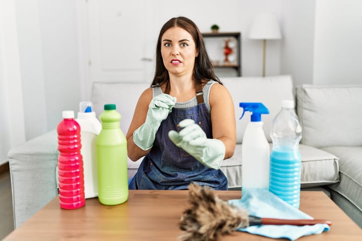woman with cleaning supplies