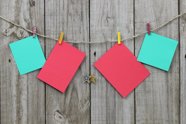 Blank Christmas note cards hanging from clothesline
