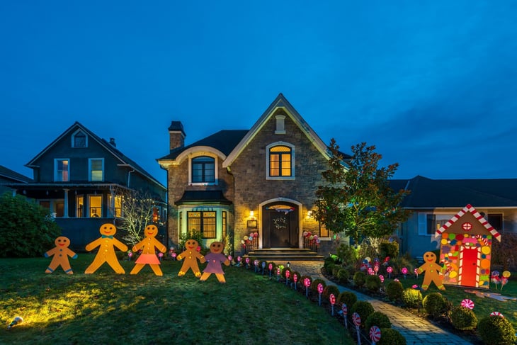 Christmas decorations on a home at night