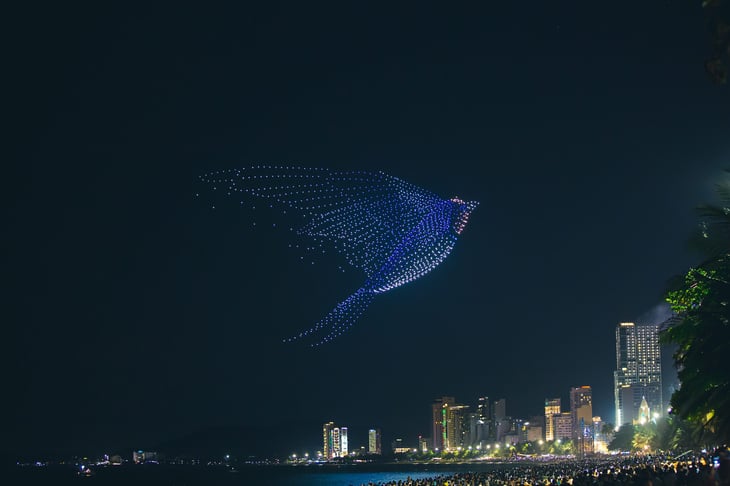 Drone light show featuring an animated bird in the night sky over Nha Trang, Vietnam