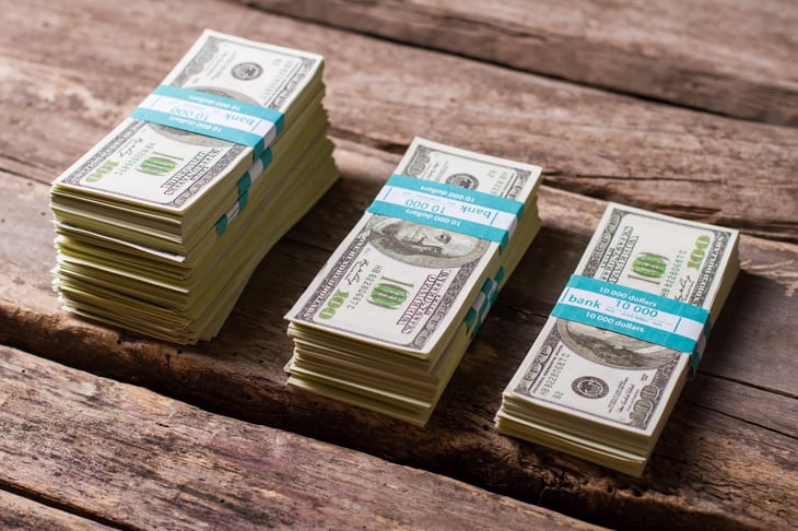 Cash stacks of different size.