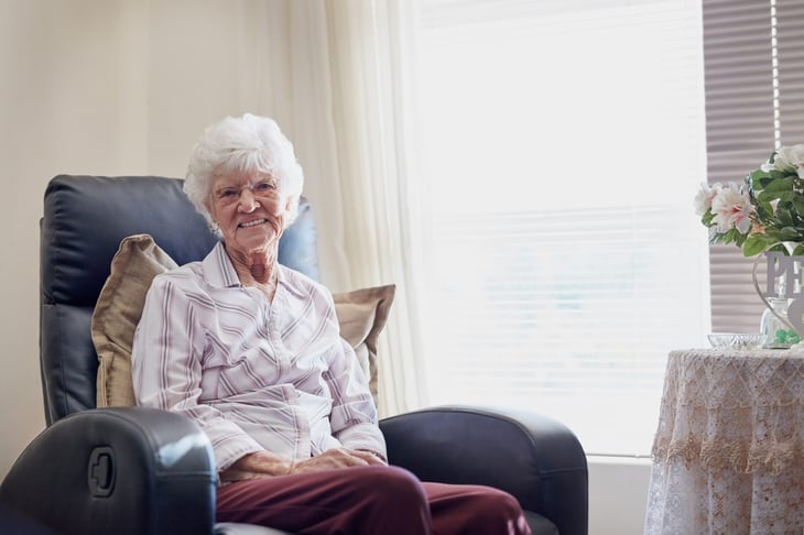 Older woman sitting in living room