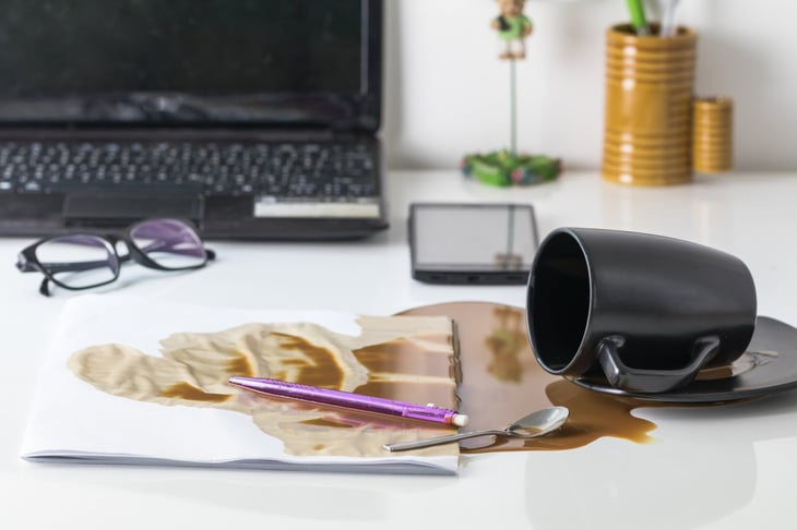 coffee spilled on important documents