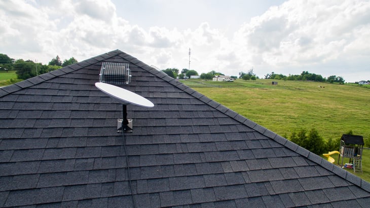 BRANT, CANADA - June 28, 2021: A SpaceX Starlink satellite dish mounted on the roof of a rural home. Starlink is an all-new satellite internet constellation, one of the first to the public market.