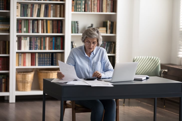older woman doing taxes