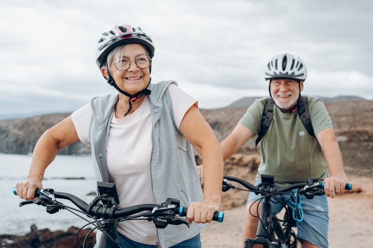 Senior couple riding bikes