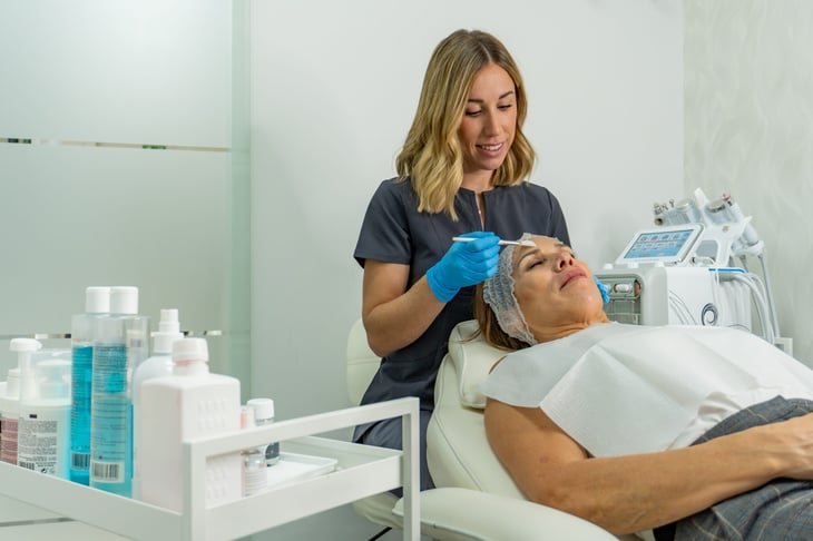 Esthetician with a patient