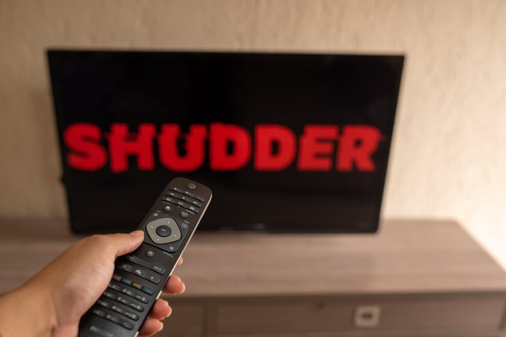 Shudder streaming service logo on a tv