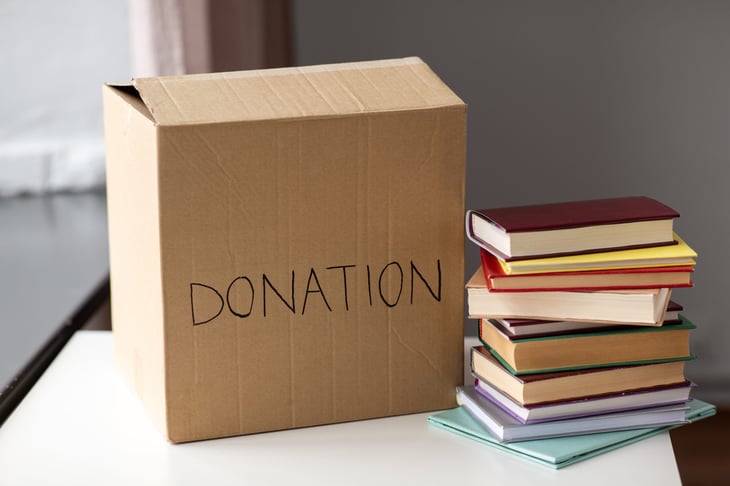 books and donation box on a table